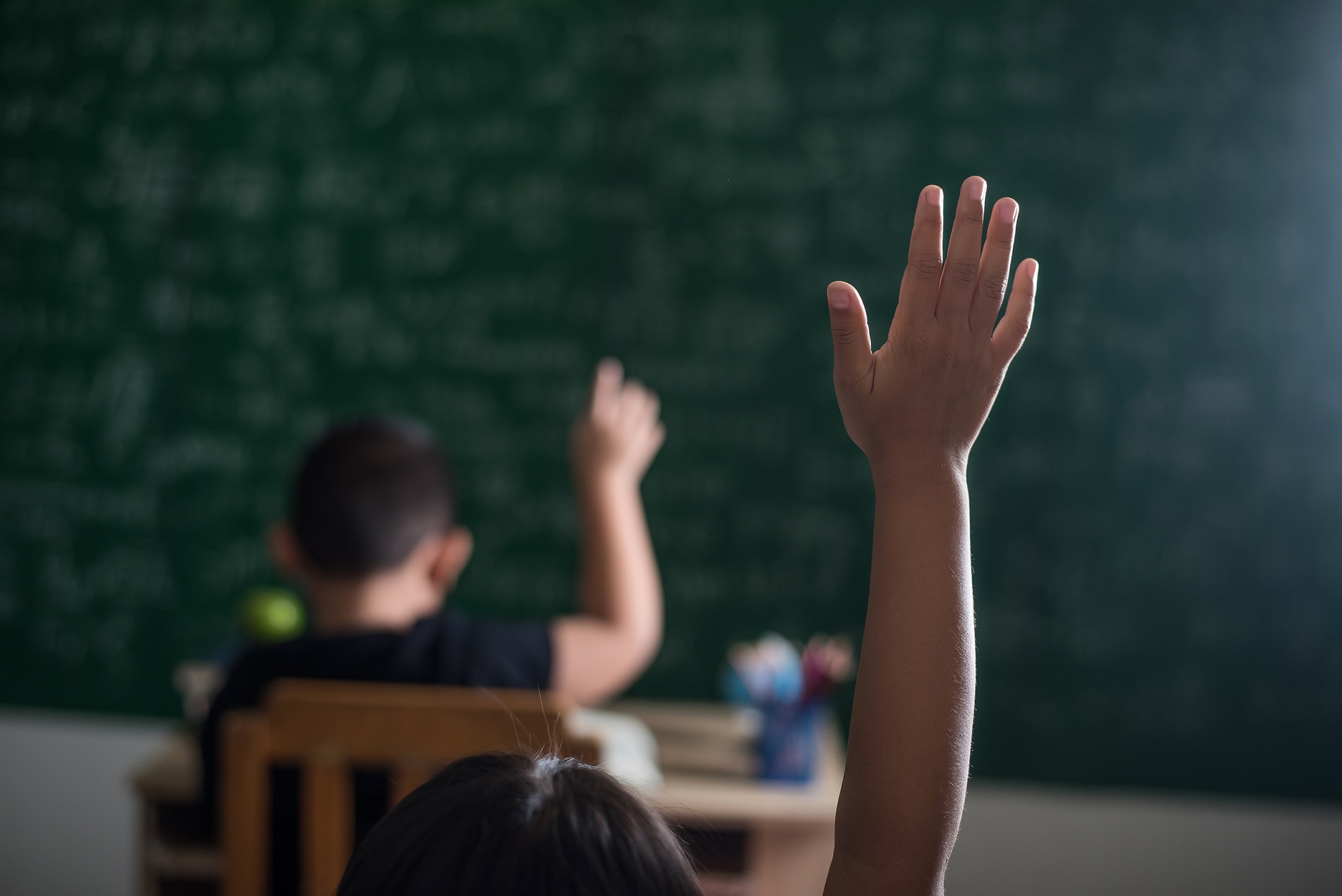 Kid Raising His Hand In Classroom (2)