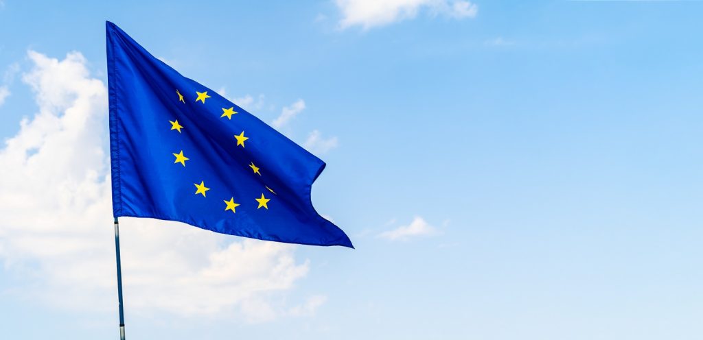 European Union Flag Against Blue Sky Waving